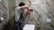 Professional plumber repairing toilet in bathroom