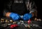 A professional plumber tightens the nut with a wrench. Close-up of the working environment in the workshop. Installation of gas