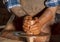 Professional potter making bowl in pottery workshop, studio