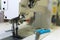 Professional production sewing machine close-up, leather production, seamstress