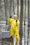 Professional in protective coveralls testing contaminated environment