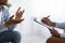 Professional psychological help concept. Unrecognizable black man talking to psychotherapist at office, closeup view