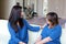 Professional psychologist female doctor dark hair with patient. Mother and daughter sharing a positive time.