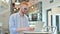 Professional Redhead Man using Laptop in Cafe