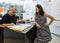 A professional salesperson helps a woman to choose reading glasses in an optometric shop in Nahariyya city in Israel