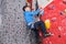 Professional senior man climbing on an artificial rock climbing wall.