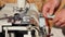 Professional shoemaker preparing leather for shoe production