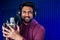 Professional singing indian men headphones sound modern studio violet background recording song.