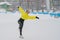 Professional skater on an outdoor ice rink. A woman on knees is preparing a solo program for the competition.