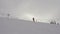 Professional Skier Fast Skiing On Ski Slope In Mountains In Winter