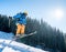 Professional skier jumping in the air while skiing in the mountains blue sky on the background