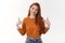 Professional skillful confident redhead european female wear makeup cropped top pointing herself indicating center index