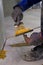 professional is skillfully filling the expansion joints with epoxy mortar using a trowel and putty knife, ensuring that the
