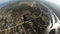 Professional skydiver parachuting above flatland. Landscape. Sunny day. River