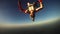 Professional skydivers falling in sky on sunset. Adrenaline. Freestyle. Flight.