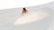 Professional snowboarder in orange sportswear riding down the mo