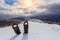 Professional snowshoes in the snow on the winter mountains and sky with clouds background. Snowshoeing