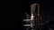 professional sound recording microphone on black background. banner with copy space