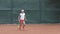 Professional sport, tennis player adolescent girl concentrating and focusing on game then hitting racket on ball at
