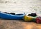 Professional sports kayak lies on the river bank