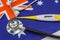 A professional stethoscope perched on a vibrant Australian flag, a symbol of the country's strong healthcare system. Medical