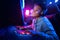 Professional Streamer African young woman cyber gamer studio room with personal computer armchair, keyboard in neon