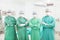 Professional surgeon teams standing in a surgical room