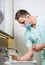 Professional surgeon washes his hands in clinic before surgery operation. Procedure to stop coronavirus.