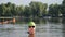 Professional swimmer in the lake on a sunny day. Only the athleteâ€™s head is visible above the water. Close up
