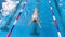 Professional swimmer in a swimming pool. Aerial view. 4K.