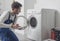 Professional technician checking a washing machine