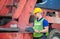 Professional technician pre-check forklift truck at container cargo, Factory worker man in hard hat, safety concept