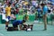 Professional tennis player Dustin Brown of Germany needs medical attention during first round match of the Rio 2016 Olympic Games