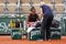 Professional tennis player Leylah Fernandez of Canada receives on-court attention for foot injury during her quater-final match