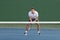 Professional tennis player man athlete waiting to receive ball, playing game on hard court. Fitness person focused