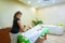 Professional therapist giving relaxing reflexology Thai oil leg massage treatment to a woman in spa