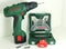 A professional tools of Bosch - one green cordless drill accumulator drill and a set of drill bits.