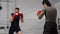 Professional training of two kickboxers on ringside in fight club.