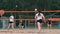 Professional volleyball serve woman on the beach tournament. Volleyball net the player blocks the view when applying