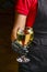 Professional waiter in uniform is serving wine in a glass. Champagne serve for party or celebration in restaurant