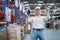 Professional warehouse manager or worker express action of happy and smiling in workplace area with concept of successful in his