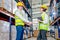 Professional warehouse worker man and woman shake hands together before work with the project in workplace area