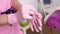 Professional woman beautician puts on her hands blue rubber clean sterile gloves before doing the procedure for cosmetic