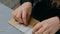 Professional woman decorator working with kraft paper and wrapping envelope