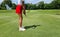 Professional woman golfer wearing sport wear teeing golf in golf tournament competition at golf course for winner