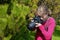 Professional woman photographer in the park