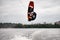 professional woman wakeboarder making trick in jump time with wakeboard