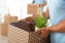 Professional worker with cardboard  and his colleague in office, closeup. Moving service