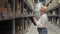 A professional worker checks stocks at a retail warehouse