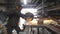 Professional worker starting cut metal by saw cutting machine. Craftsman with circular saw sawing steel in garage. Man